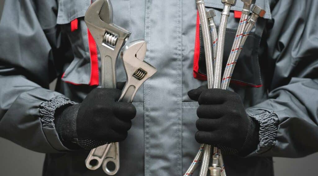 plumber holding tools